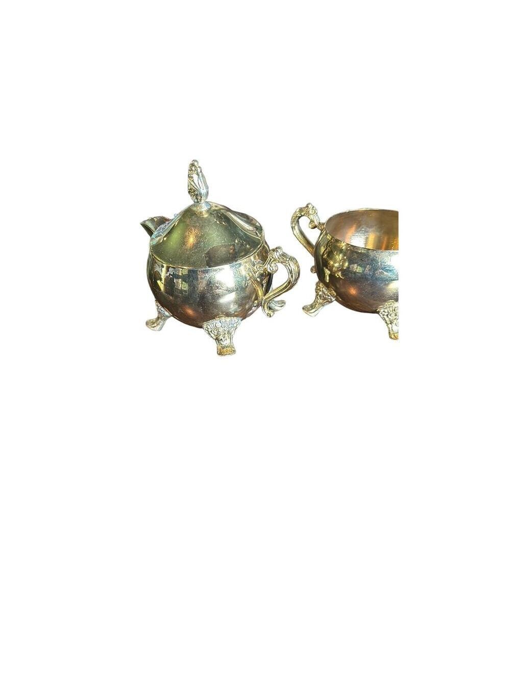 Brass plated china cream and sugar set